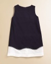 A spirited frock in textured woven piqué has a fresh, nautical appeal.Jewel neckline Sleeveless Back zip closure A-line shape Contrast wave-pattern hem with striped braid Fully lined Cotton; dry clean Made in USA