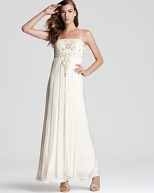 Soft strips of grosgrain ribbon lend a free-flowing look to the skirt of this classic Sue Wong gown, dressed up with beaded details. Soft strips of grosgrain ribbon lend a free-flowing look to the skirt of this classic Sue Wong gown, dressed up with beaded details.