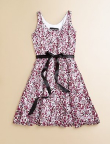 A cheery, vibrant floral print and sweet ribbon tie sash make this dress stand out from the rest.ScoopneckSleevelessPullover styleWaistband with ribbon tieFull skirt90% nylon/10% spandexHand washMade in the USA of imported fabric A cheery, vibrant floral print and sweet ribbon tie sash make this dress stand out from the rest.ScoopneckSleevelessPullover styleWaistband with ribbon tieFull skirt90% nylon/10% spandexHand washMade in the USA of imported fabric