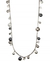 An elegant effect. Gray glass pearls are complemented by glittering glass accents and a silver tone setting on this long necklace from Givenchy. Crafted in mixed metal. Approximate length: 42 inches.