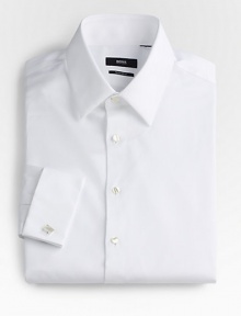 A formal style woven with a subtle diamond texture in crisp cotton. Buttonfront Modified point collar Bluff edge French cuffs Cotton; dry clean Imported 