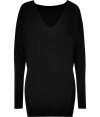 Luxe black oversized V-neck top from Donna Karan -Add instant chic to your day look with this versatile top - On-trend oversized fit, flattering V-neckline, dolman-inspired sleeves - Pair with leather paneled leggings, a fringed scarf, and platform booties