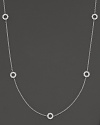 A delicate white gold chain with 5 double-sided white gold diamond circle stations.