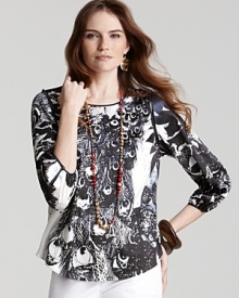 This flowing T Tahari printed top is lavished in a black-and-white peacock design for an original way to wear the season's requisite animal prints. Pair this striking piece over color-surge denim for an eye-catching day or evening look. This flowing T Tahari printed top is lavished in a black-and-white peacock design for an original way to wear the season's requisite animal prints. Pair this striking piece over color-surge denim for an eye-catching day or evening look.