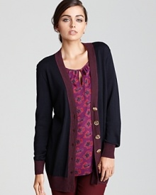 Touting a slouchy fit and stunning logo buttons, this Tory Burch cardigan eases into the season with classic menswear inspiration. Slip the style over a feminine blouse for the perfect boy-meets-girl mix.