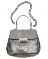 Ivanka Trump lavishes her debut handbags line with posh details, like the metallic finish and goldtone hardware on the Topaz flap purse.