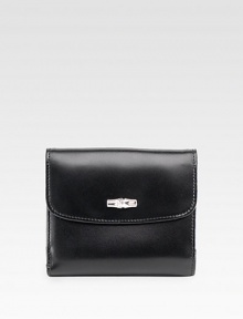 A polished flap-front wallet made of sumptuously-soft leather, finished with sleek back snaps. Snap flap closureThree credit card slotsFully lined4½W X 3¾H X ½DMade in France A polished flap-front wallet made of sumptuously-soft leather, finished with sleek back snaps. Snap flap closureThree credit card slotsFully lined4½W X 3¾H X ½DMade in France