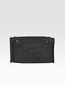 A classic travel kit made from signature ballistic nylon features include interior elastic loops, an outside zip pocket and webbing handle strap. Zip closure Nylon lining 10¾W X 6¼H X 3½ Imported A classic travel kit made from signature ballistic nylon features include interior elastic loops, an outside zip pocket and webbing handle strap. Zip closure Nylon lining 10¾W X 6¼H X 3½ Imported