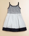 Crafted in plush cotton, this fancy frock's smocked bodice, full skirt and perky polka dots complete the look.Spaghetti strapsRound necklineButton backSmocked bodiceBack tie waistFull skirtFully linedCottonMachine wash coldImported Please note: Number of buttons may vary depending on size ordered. 