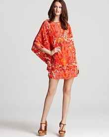 With its vibrant paisley print and caftan-like silhouette, this Trina Turk dress embraces a '70s sensibility in a thoroughly modern way. With its vibrant paisley print and caftan-like silhouette, this Trina Turk dress embraces a '70s sensibility in a thoroughly modern way.