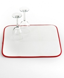 Where dishes go to dry. Cushioned and super absorbent, this kitchen mat sets up a place where your delicate dishes and stemware, plus everyday essentials, can hang out to dry after a wash. The folding, machine-washable design is perfect for easy storage and quick cleanup, too.