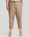 Put a summery spin on classic khakis in Calvin Klien's rolled cuff pants. Feminine heels elongate the silhouette.