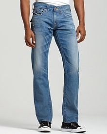These classic True Religion straight leg jeans in a weathered blue wash feature back and coin flap pockets with signature horseshoe stitching at the pockets. These classic True Religion straight leg jeans in a weathered blue wash feature back and coin flap pockets with signature horseshoe stitching at the pockets.