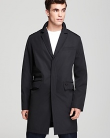 A modish mid-length coat that translates from work to after hours from Tumi. A modish mid-length coat that translates from work to after hours from Tumi.