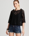 This ladylike lace Joie top lends elegance to everything from little black pants to skinny jeans. Flaunting scallop trim and a back button placket, the piece should be layered over a simple camisole.