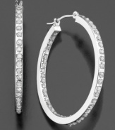 Dazzling diamond accents line these brilliant hoop earrings inside and out. Crafted in 14k white gold. Approximate diameter: 1 inch.