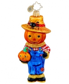 Dress things up for Halloween with a Scary the Scarecrow ornament. A jack-o-lantern head is the pick of the patch, paired with farmer coveralls and red plaid painted in classic Christopher Radko style.