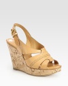 Natural cork wedge with rich leather straps and an adjustable slingback. Cork wedge, 4 (100mm)Cork platform, 1 (25mm)Compares to a 3 heel (75mm)Leather upperLeather lining and solePadded insoleMade in ItalyOUR FIT MODEL RECOMMENDS ordering one half size up as this style runs small. 