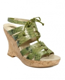 A tropical fashion trip. The Sunny wedge sandals by Tahari live up to their name with exotic snake-print leather straps and an earthy cork wedge heel.