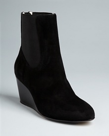 These Taryn Rose booties meet all the current fashion requirements, in a modern, streamlined design in luxurious suede. It's the hidden insoles-a hallmark of this orthopedic surgeon-turned-designer-that will have you wearing them around the clock. These Taryn Rose booties meet all the current fashion requirements, in a modern, streamlined design in luxurious suede. It's the hidden insoles-a hallmark of this orthopedic surgeon-turned-designer-that will have you wearing them around the clock.