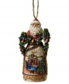 Christmas comes early in the elaborate carved skirt of Jim Shore's Deck the Halls Santa ornament. A picture-perfect holiday morning is topped with St. Nick, his arms full of colorful garland.