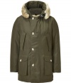 Stylish and sporty olive down coat in a washable cotton blend from the American heritage label Woolrich - Tapers slightly at waist, hits at mid-thigh - Rabbit fur collar lends this coat a veritable feeling of warmth and luxe - Water and snow resistant, with multiple pockets and hood - Exceptionally warm, can be worn in temperatures as low as -30 F - A versatile, classic coat perfect for both city streets and country slopes