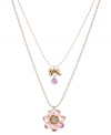 Time for a little romance. Betsey Johnson's sweet, two-row pendant necklace features a blue and pink crystal-encrusted flower and a petite ribbon charm. Crafted in antique gold-plated mixed metal. Approximate length: 16 inches + 3-inch extender. Approximate drop: 2-3/4 inches.