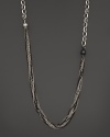 A gorgeous jumble of dark and white sterling silver chains. By Gurhan.