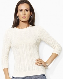 Inspired by the classic fisherman's sweater, this cable-knit sweater is modernized with chic three-quarter length sleeves and a cotton-linen construction. Inspired by the classic fisherman's sweater, this cable-knit sweater is modernized with chic three-quarter length sleeves and a cotton-linen construction.