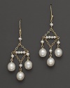 Triple-drop chandelier earring in 14 Kt. yellow gold.