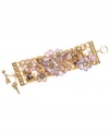 Embrace your inner romantic with Betsey Johnson's sweetly shimmering cuff bracelet. Crafted in antique gold-plated mixed metal, this wide toggle bracelet features a multitude of flower charms accented by pink, purple and blue crystals and glass pearls. Approximate length: 8 inches.