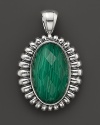 A faceted malachite doublet is trimmed in fluted sterling silver on this Lagos pendant.