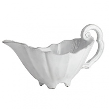 Handmade from Venetian terra marrone, or brown clay, this sauce server brings a rustically sophisticated note to your table. Handmade from Venetian terra marrone, or brown clay, this sauce server brings a rustically sophisticated note to your table.