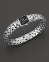 Large signature sterling woven chain bracelet with carved chain black sapphire clasp, designed by John Hardy.