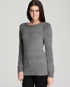 This charming French Connection crewneck sweater boasts the season's minimalist design sensibility with the distinct flourish of knitted baubles at the shoulders.