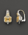 Sterling silver earrings set with faceted white sapphires and canary crystal. By Judith Ripka.