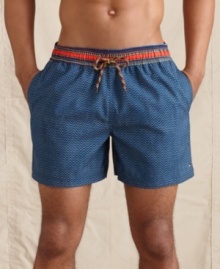 Staggering. The bold print on these Congo swim trunks from Tommy Hilfiger stands out in the crashing surf. Part of the Millennium Promise Collection, which showcases clothing either made in Africa or with cotton sourced from local growers. Staggering. The bold print on these Congo swim trunks from Tommy Hilfiger stands out in the crashing surf. Part of the Millennium Promise Collection, which showcases clothing either made in Africa or with cotton sourced from local growers.