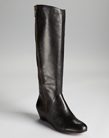 Corso Como's Doyle boots make a statuesque appearance in pebbled leather, equipped with a 2 wedge for a luxe lift. Corso Como's Doyle boots make a statuesque appearance in pebbled leather, equipped with a 2 wedge for a luxe lift.