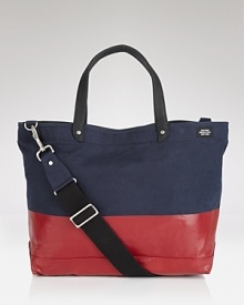 This durable, downtown tote is perfect for everyday use with its modern color block design and reinforced material. This durable, downtown tote is perfect for everyday use with its modern color block design and reinforced material.