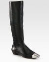 Tall silhouette of butter-soft leather, finished with a square metal cap toe for modern appeal. Shaft, 15¾Leg circumference, 14Leather upper with metal cap toePull-on styleLeather lining and solePadded insoleImportedOUR FIT MODEL RECOMMENDS ordering one half size up as this style runs small. 