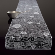 The bling of this season's tabletop. 100% liquid pressed vinyl in a gold coral design.