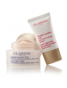 Clarins' exclusive pioneer plant extracts help defy dark spots, dullness and wrinkles for a smooth, unified skin tone. Visibly lifts, firms and restores the deep luminosity of young-looking skin. Duo includes: Full-size Vital Light Night Revitalizing Anti-Aging Cream and travel-size Vital Light Day Illuminating Anti-Aging Cream. Made in France. Clarins' exclusive pioneer plant extracts help defy dark spots, dullness and wrinkles for a smooth, unified skin tone. Visibly lifts, firms and restores the deep luminosity of young-looking skin. Duo includes: Full-size Vital Light Night Revitalizing Anti-Aging Cream and travel-size Vital Light Day Illuminating Anti-Aging Cream. Made in France.