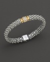 Sterling silver Caviar™ beading on a rope bracelet with a station of pavé diamonds, designed by Lagos.