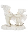 With innocent looks upon their faces, this pair of Snowbabies, with silver ice skates and white hats, are having a grand time ice skating together. Crafted of pure porcelain in the timeless style of Department 56.