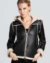 Plush faux shearling lines this Moschino Cheap and Chic coat--a chic winter wardrobe essential.