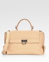 Exquisite Vitello leather, impeccably structured in a classic top handle silhouette with polished hardware and dual carrying options.Top handle, 5 dropRemovable adjustable shoulder strap, 19-22 dropFlap over zip closureOne outside zip pocketProtective metal feetOne inside zip pocketTwo inside open pocketsFully lined14W X 10H X 6½DMade in Italy