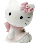 Wearing a pretty pink bow and scalloped dress, Hello Kitty is the essence of cute in this soon-to-be-cherished porcelain figurine from Nao by Lladro.
