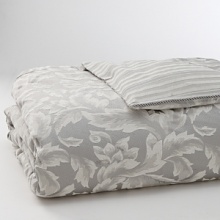 Shimmering in a platinum floral print, this duvet adds a touch of refined charm to your bedroom. Features a striped print on reverse. Shimmering in a platinum floral print, this duvet adds a touch of refined charm to your bedroom. Features a striped print on reverse.