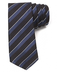 A luxury tie for the modern man in premier Italian silk, featuring a skinny width and a sharp tonal stripe design that pairs easily with your refined dress shirting. A luxury tie for the modern man in premier Italian silk, featuring a skinny width and a sharp tonal stripe design that pairs easily with your refined dress shirting.