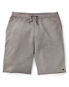 Soak up the sun in these laid back MARC BY MARC JACOBS board shorts with a classic fit and drawstring waistband.